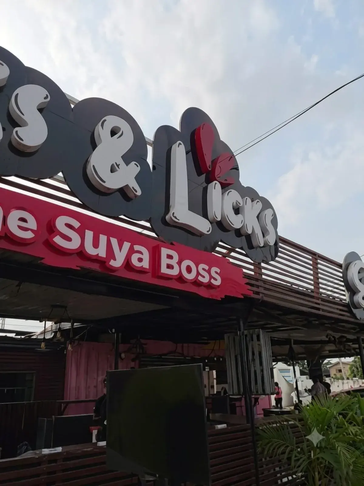 Flicks & Licks storefront signage in Haatso Atomic, home of the Suya Boss